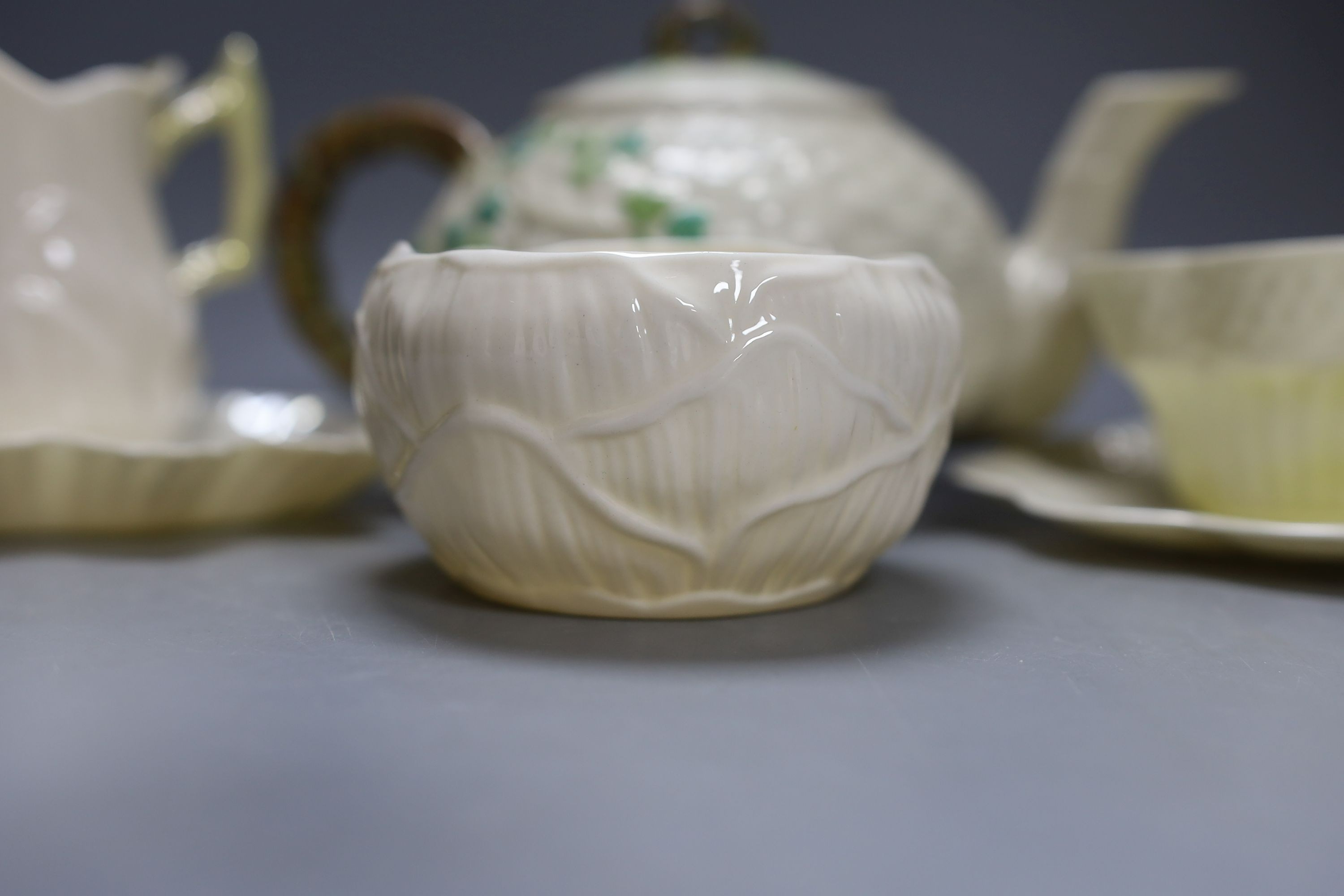 Matching Belleek sugar bowl milk jug and dish together with another Baleek cup and saucer and teapot (6)